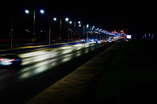 Night view of a well-lit highway with freshly painted lane markings