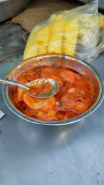 a bowl of food with a spoon in it