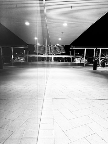 Black and white photo of a modern office space with clean lines and minimalistic design, reflecting strategic focus.