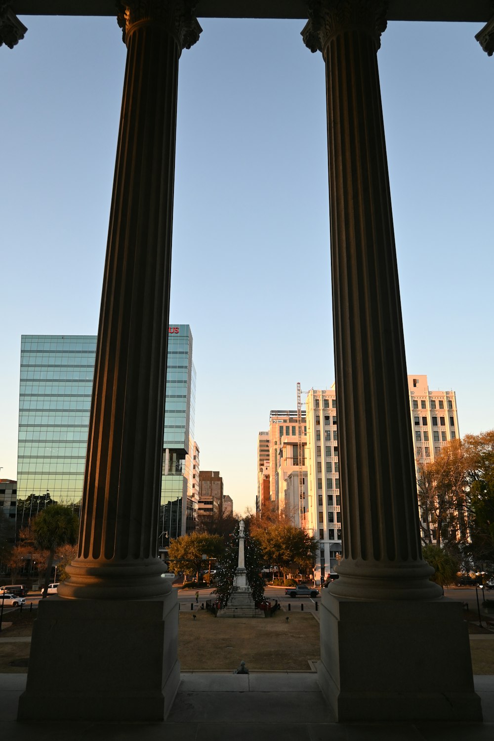 a couple of large pillars sitting in the middle of a park