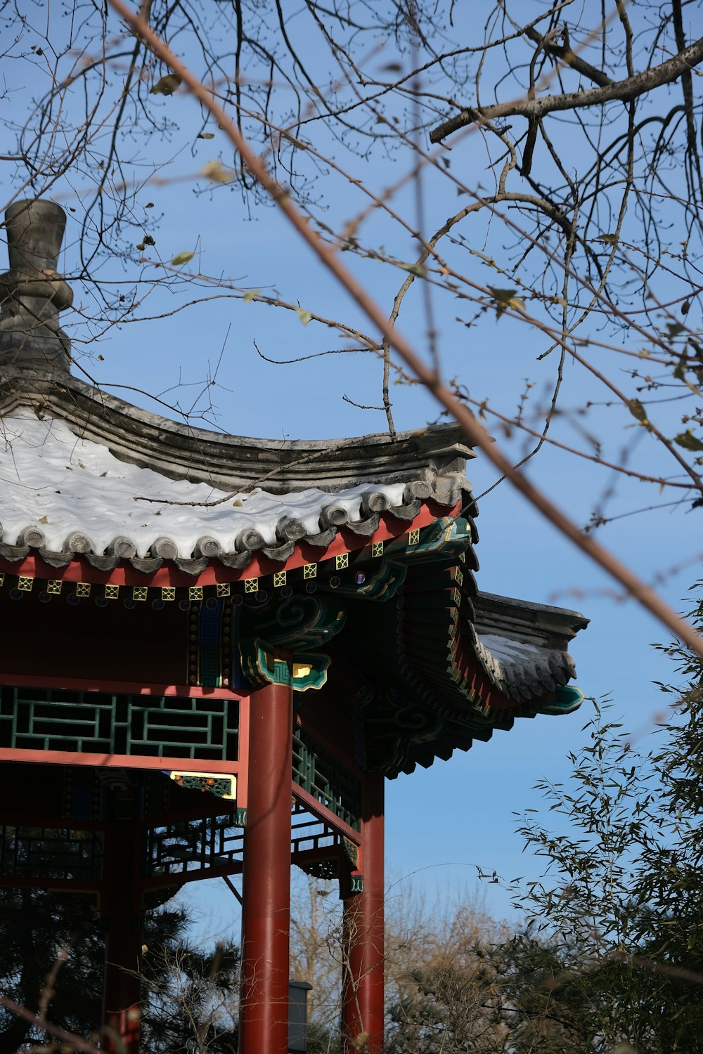 a red pagoda with a blue sky in the background