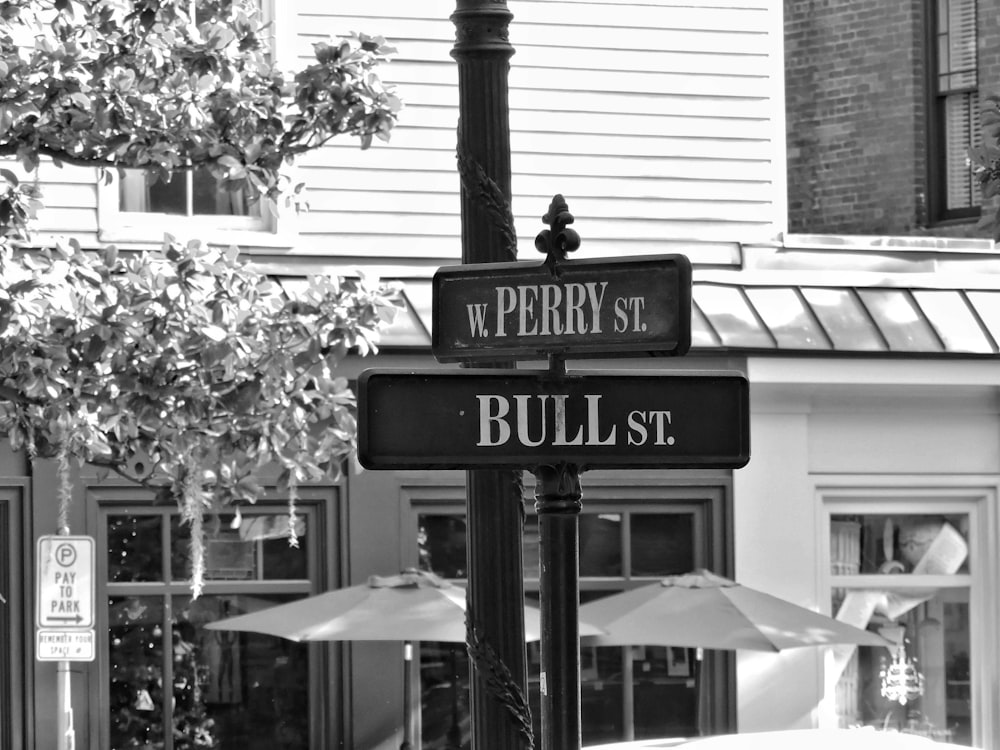 a black and white photo of a street sign