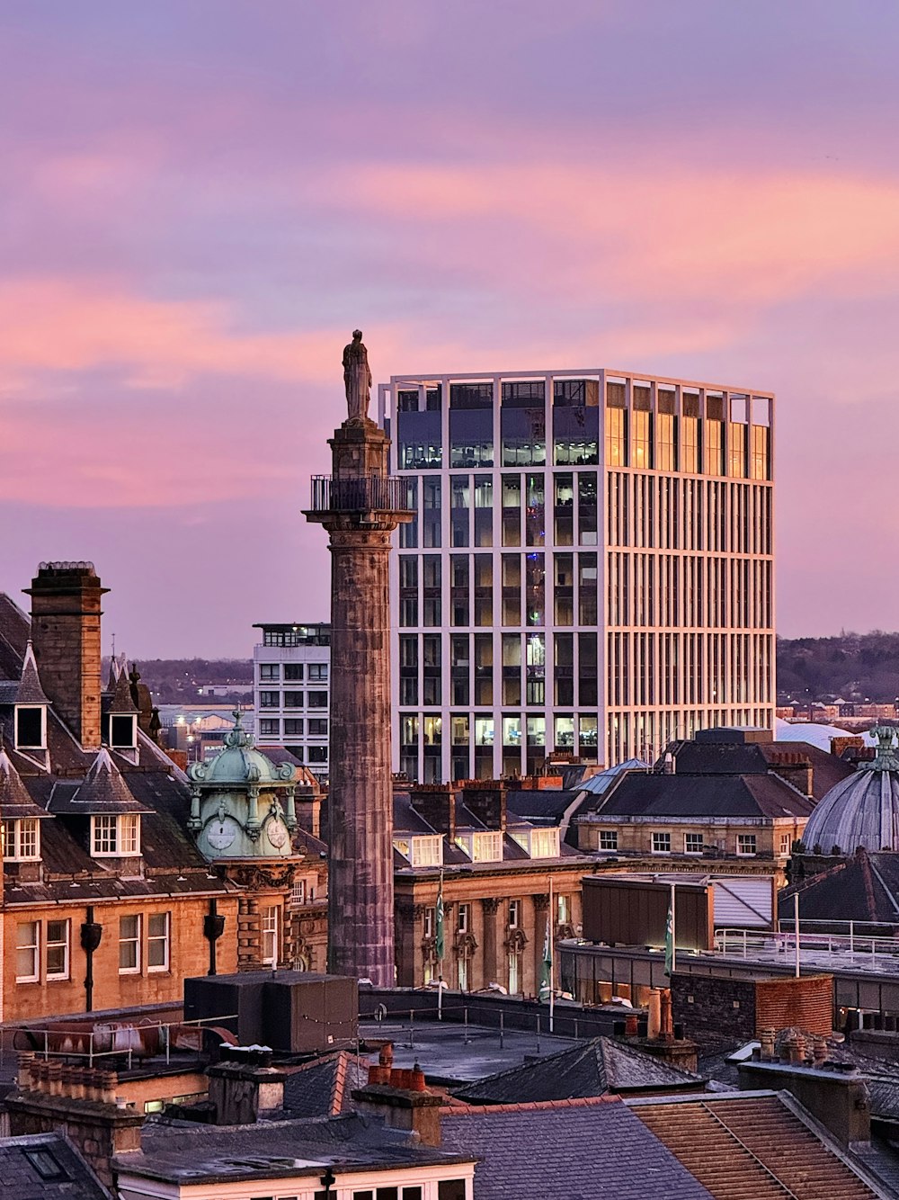 a view of a city with tall buildings and a clock tower