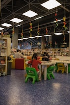 A community event showcasing local families participating in literacy activities and enjoying storytelling sessions.