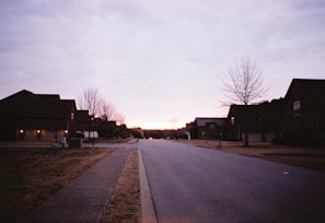 Sunset over a quiet suburban street lined with under-construction homes in Nagpur.