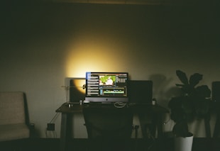 a computer monitor sitting on top of a desk