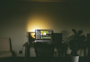 a computer monitor sitting on top of a desk