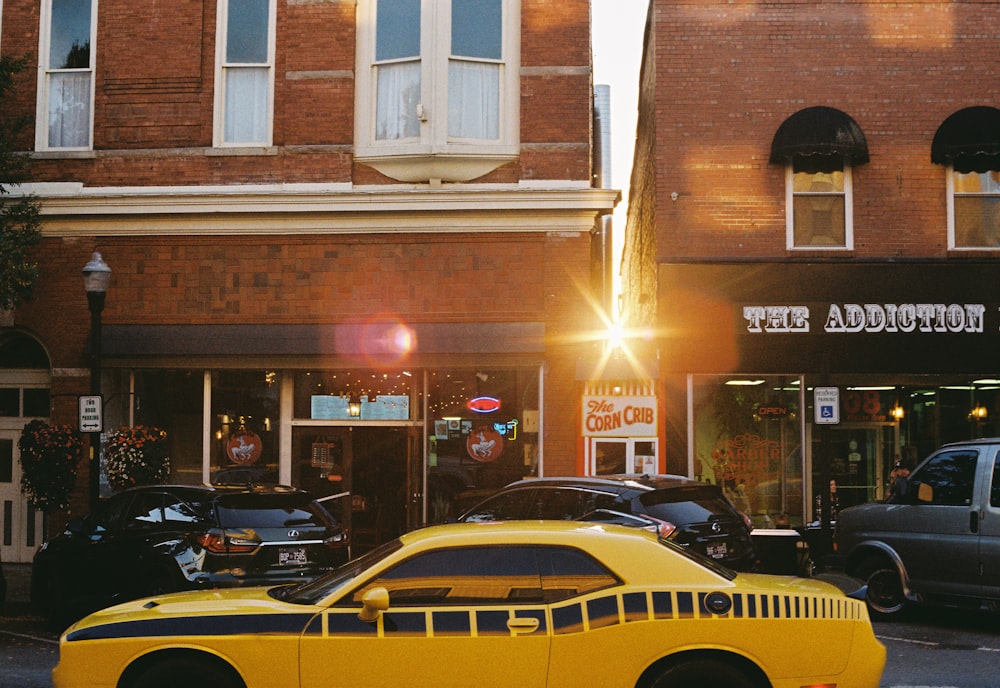 a yellow car parked in front of a building