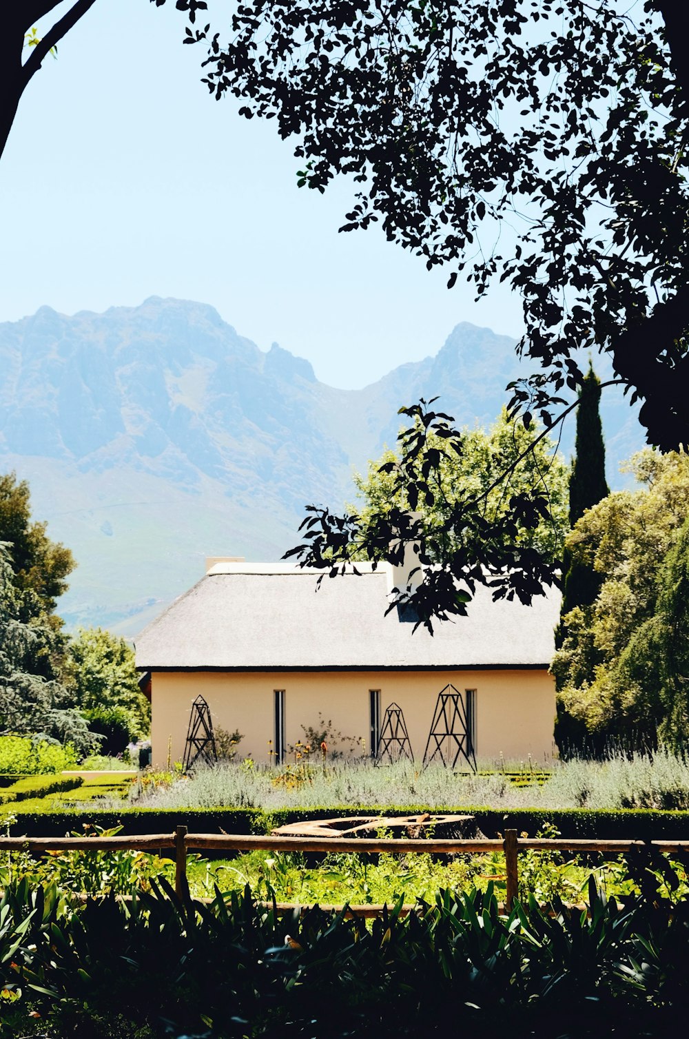 a house with mountains in the background