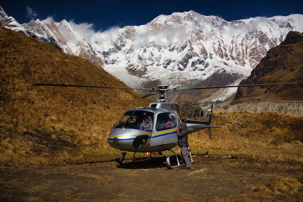 a helicopter that is sitting in the dirt