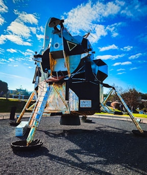 a large metal space structure with a ladder attached to it