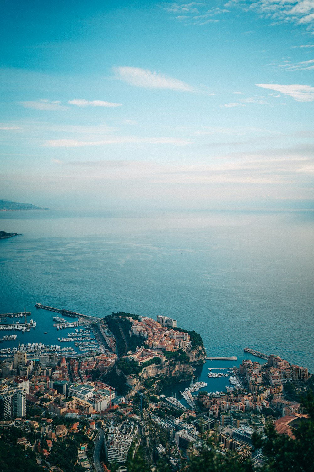 a scenic view of a city and a body of water