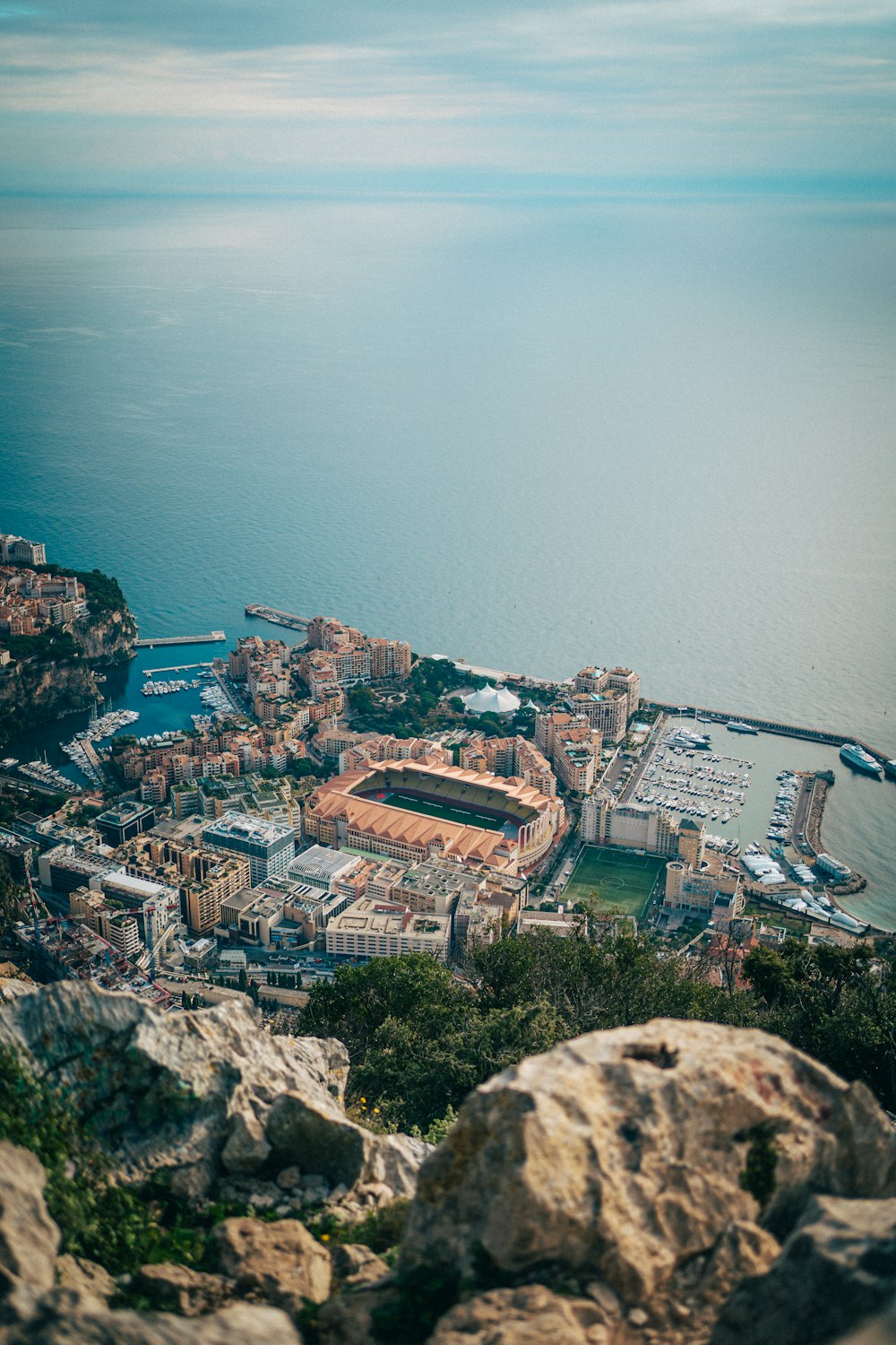 an aerial view of a city with a large body of water