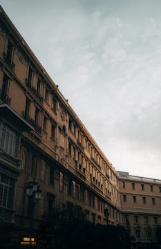 Muted architectural detail of a stately European building facade at dusk.