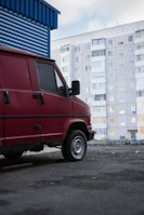 Mobile locksmith van parked in front of an apartment complex receiving service requests.