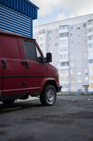A service van parked outside a residential building.