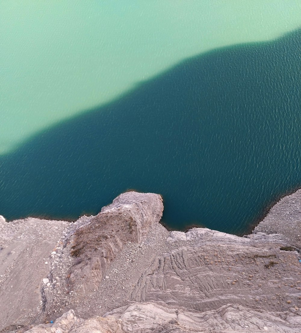 a large body of water surrounded by rocks