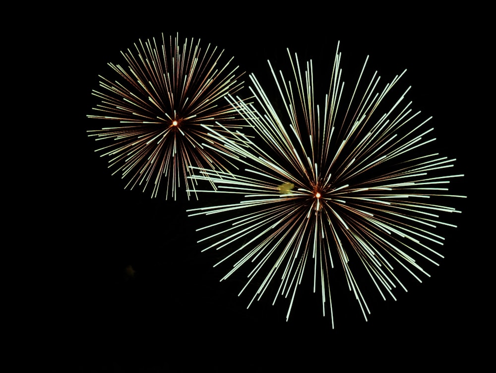 a couple of fireworks that are in the sky