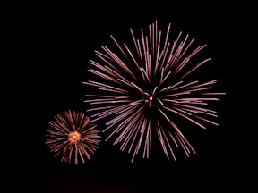 a couple of fireworks that are in the sky
