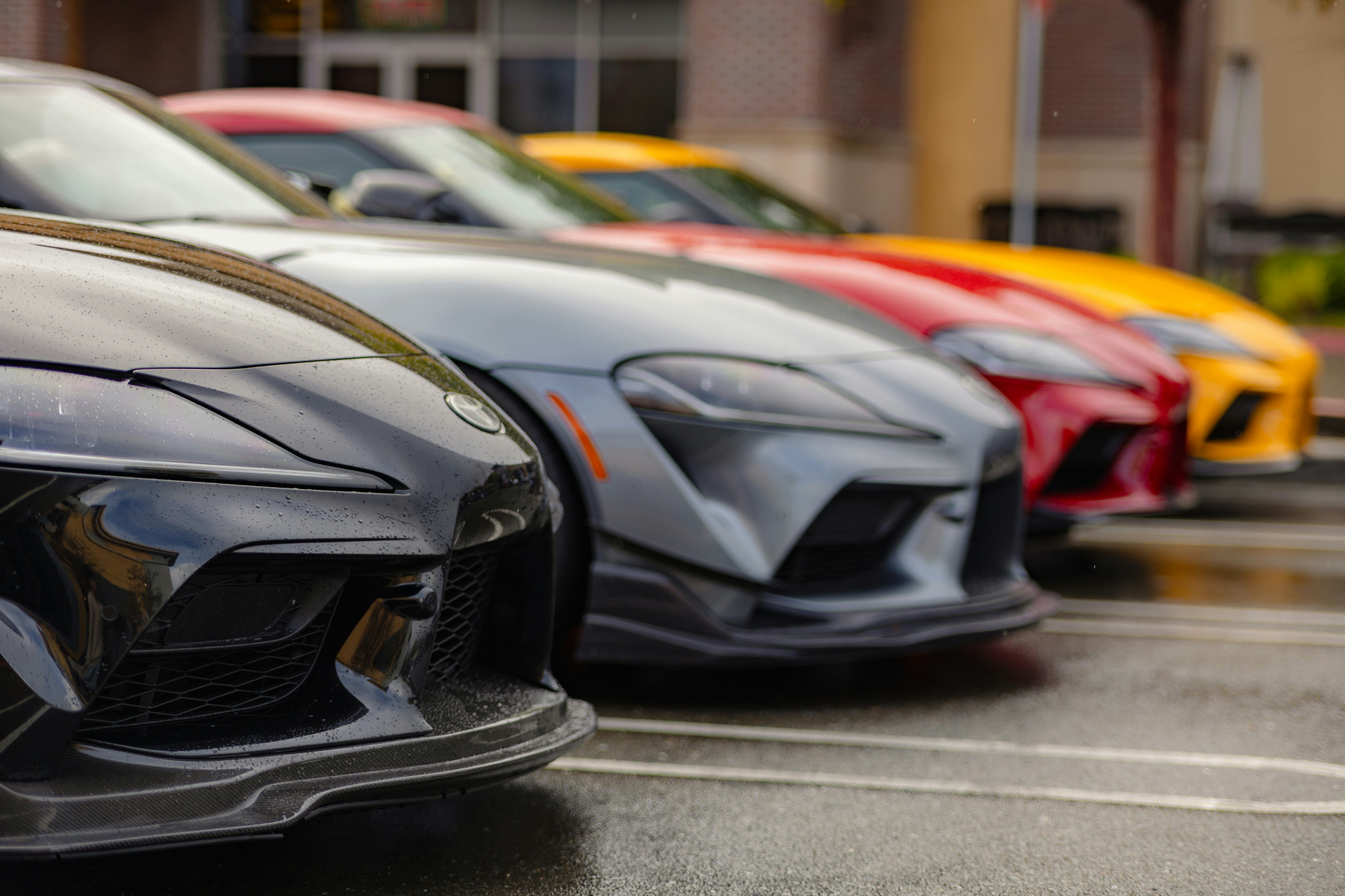 a row of cars parked in a parking lot