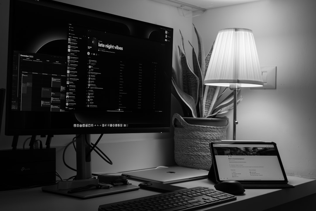 a computer monitor sitting on top of a desk, Late Night Planning