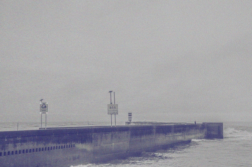 a large body of water next to a pier