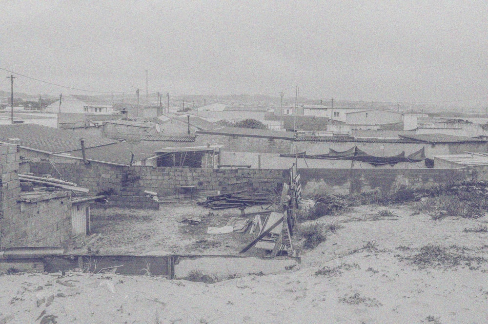 a black and white photo of a snow covered town