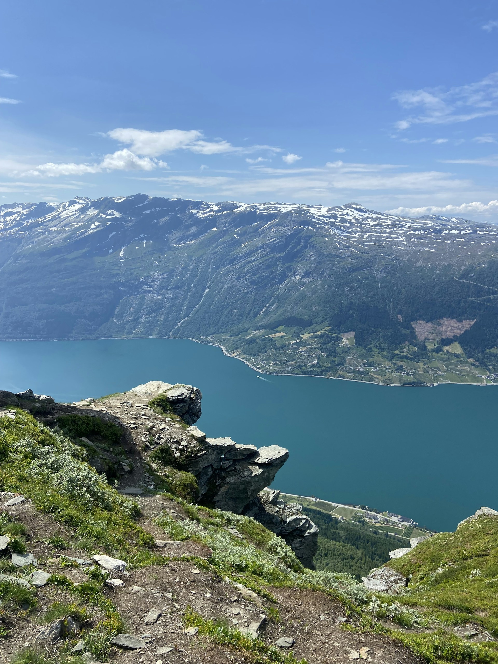 woman wearing yellow long-sleeved dress under white clouds and blue sky during daytime