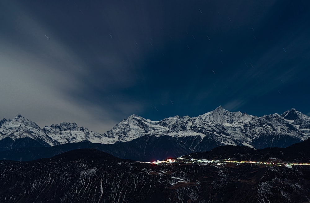 a view of a mountain range at night