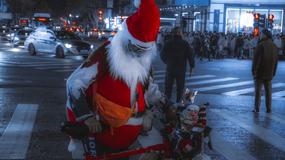 a man dressed as santa claus sitting on the side of a road