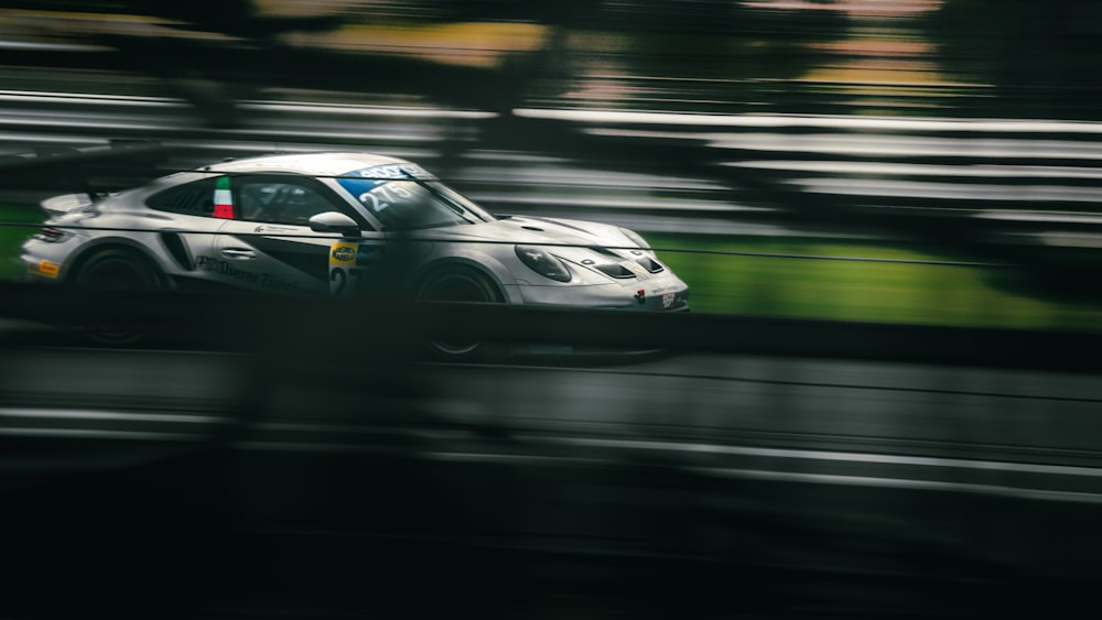 a race car driving down a wet track