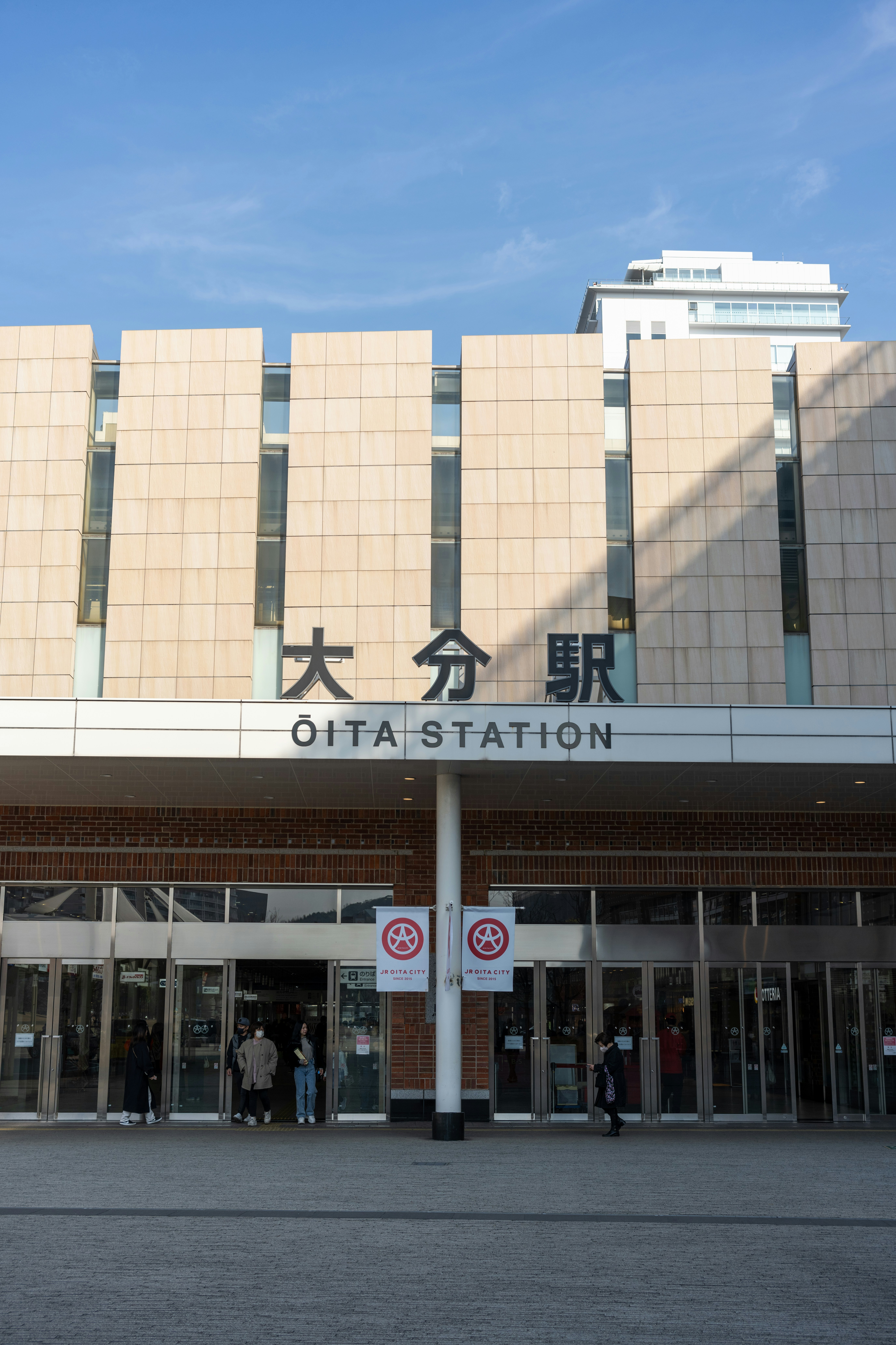 a large building with a lot of people standing outside of it