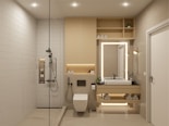 A bright bathroom with a walk-in shower, contemporary sink, and natural accents.