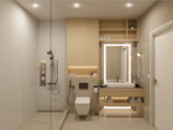 Ensuite bathroom with a walk-in shower and fresh towels neatly arranged.