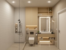 A modern, minimalistic bathroom featuring a walk-in shower with a rain shower head, a built-in shelf with toiletries, and a floating vanity with backlit mirror. The space includes a wall-mounted toilet, neatly stacked towels, potted plants, and recessed ceiling lights for a clean and organized look.