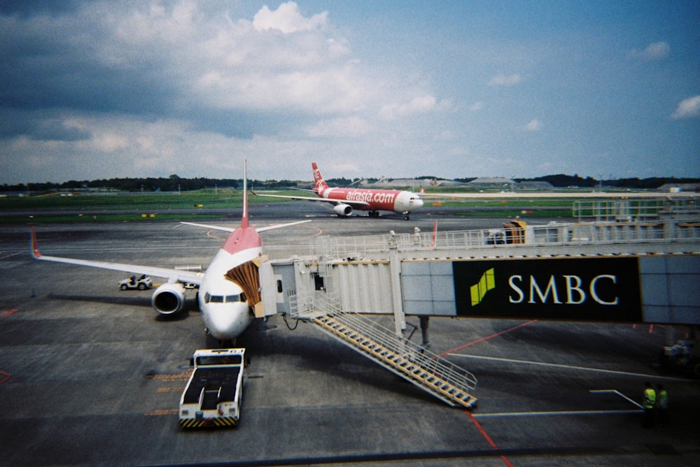 a large jetliner sitting on top of an airport tarmac