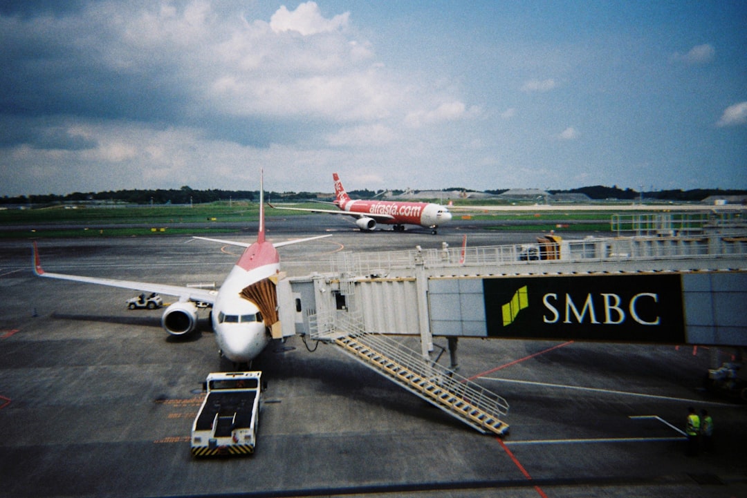 a large jetliner sitting on top of an airport tarmac,