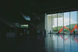 A spacious educational building with colorful accents and natural light flooding the interiors.