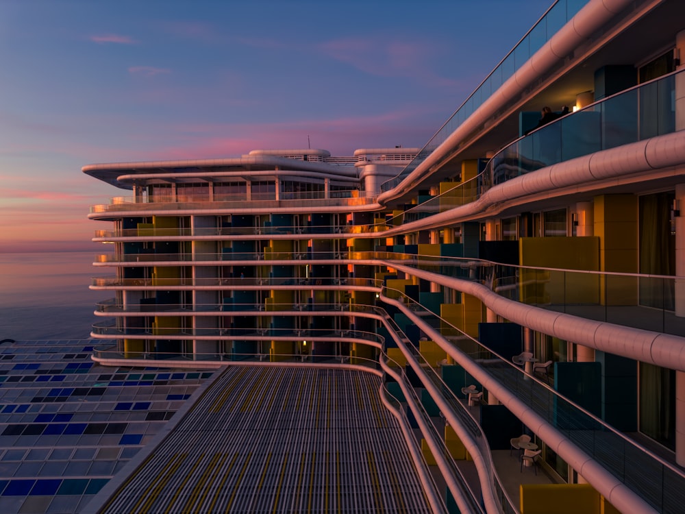 a very tall building next to a body of water