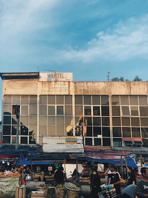Happy condominium residents picking items from the market during their daily routine.