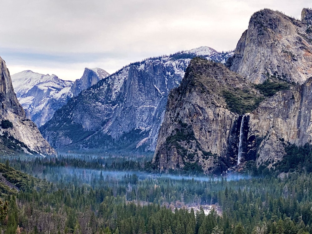 a mountain range with a waterfall in the middle of it