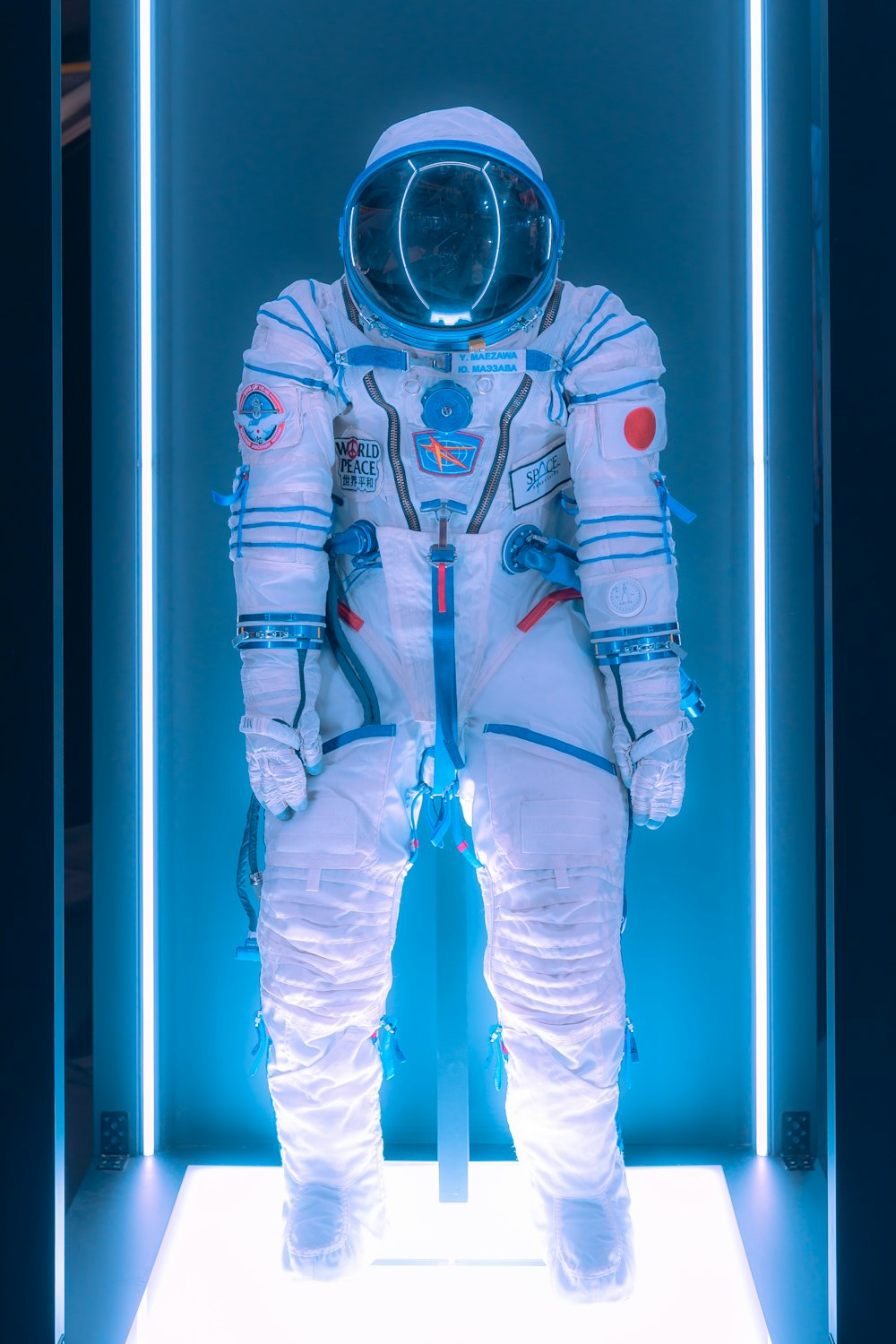 a man in a space suit standing in a doorway
