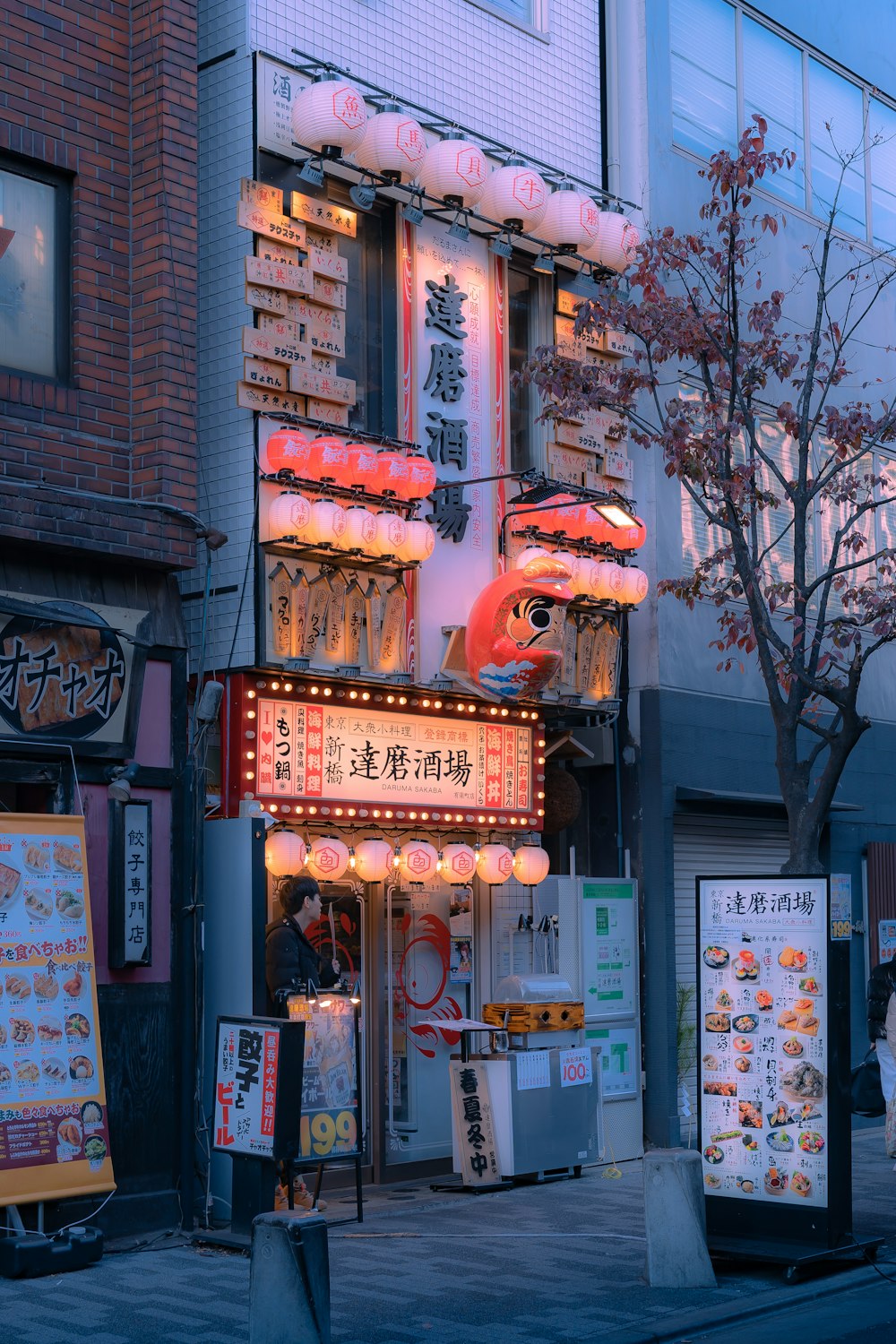 a building with a neon sign on the side of it