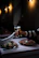 Happy customers enjoying pizza and drinks together in a warm, inviting restaurant setting.