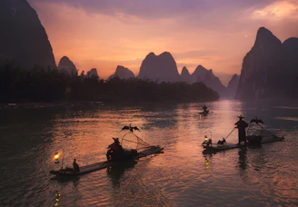 A scenic river cruise through the lush jungles of Laos at dusk