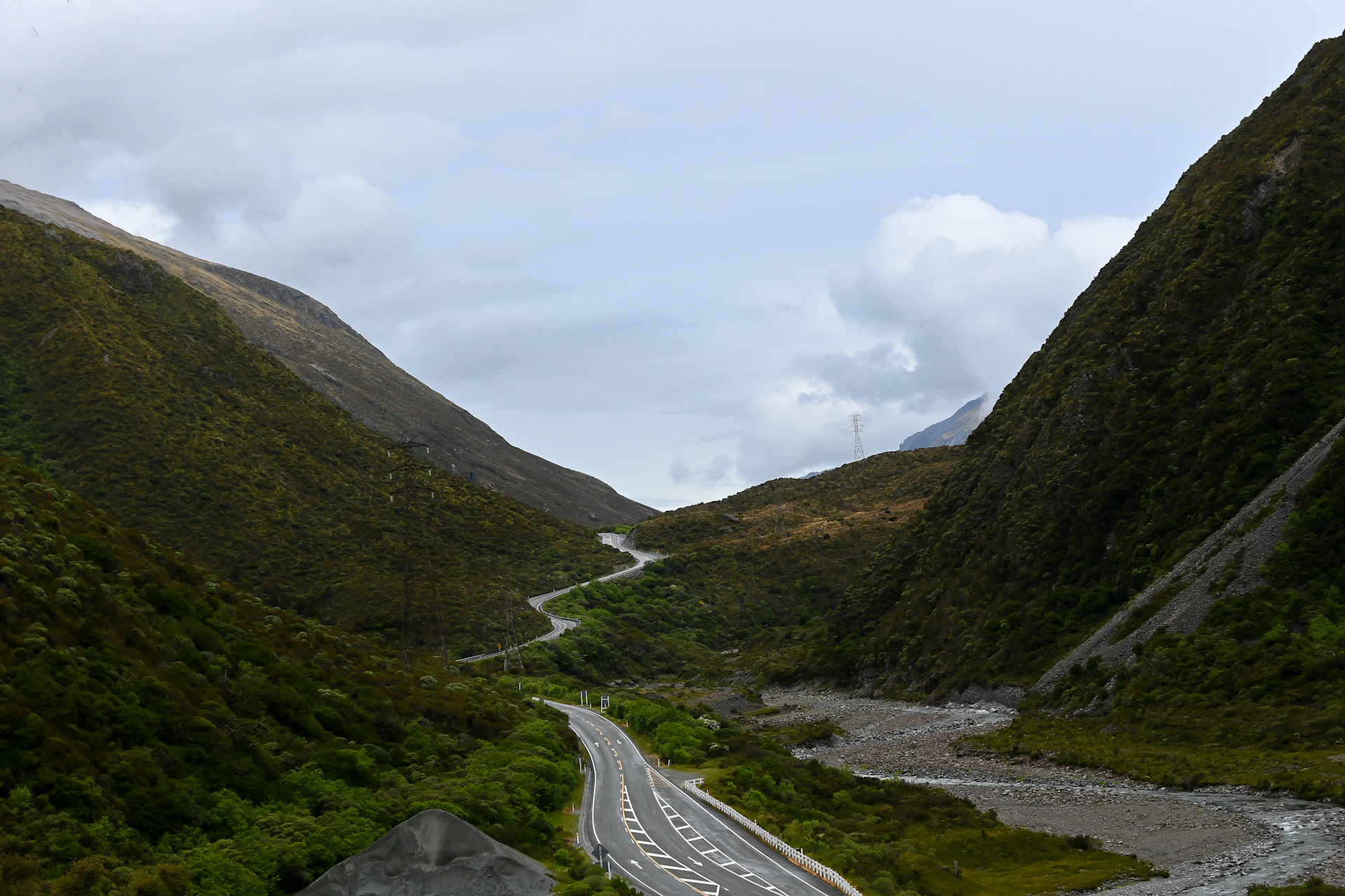 a winding road in the middle of a mountain range