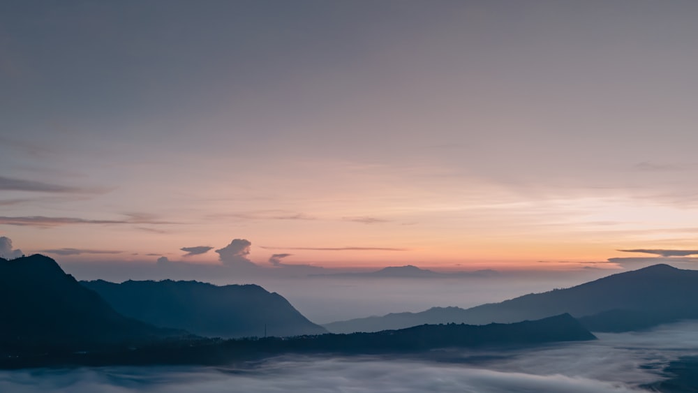 a view of a mountain range at sunset