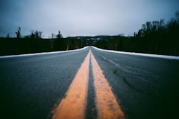 a road with a yellow line on the side of it