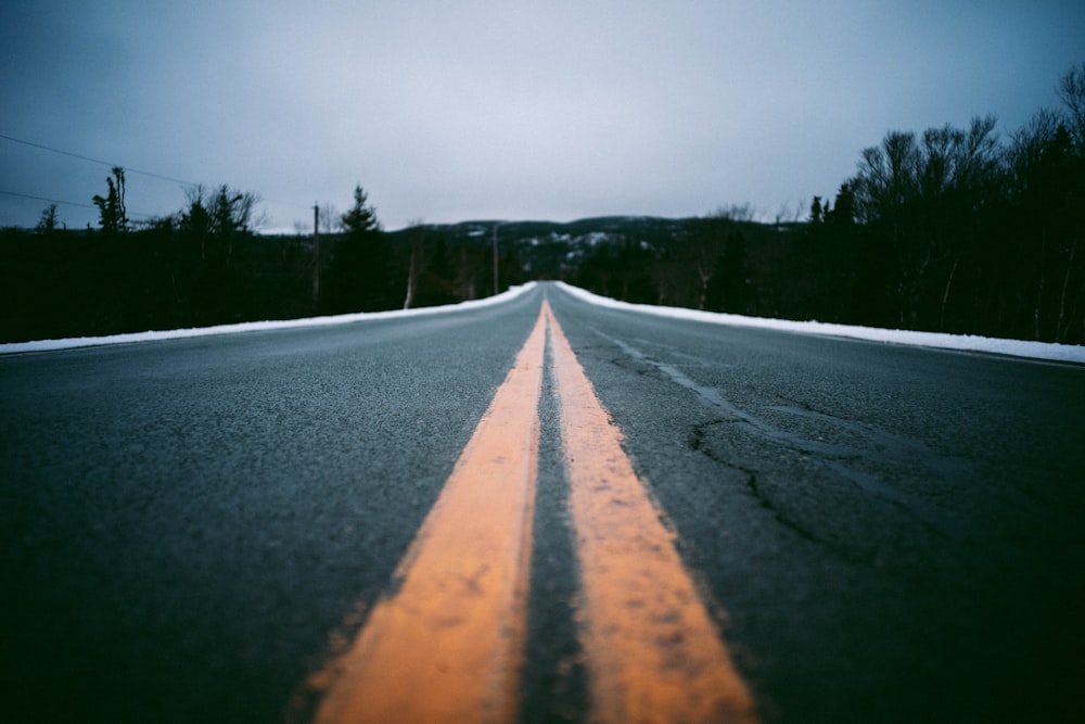 a road with a yellow line on the side of it