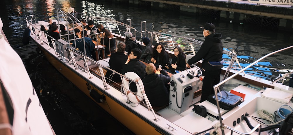 a group of people riding on the back of a boat